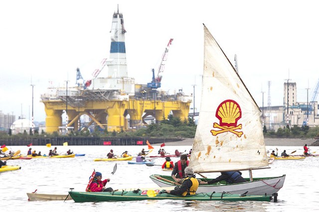 SEATTLE, WA - MAY 16: ShellNo flotilla participants float near the Polar Pioneer oil drilling rig during demonstrations against Royal Dutch Shell on May 16, 2015 in Seattle, Washington. On Saturday demonstrators began three days of protests both on land and on Puget Sound over the presence of the first of two Royal Dutch Shell oil rigs in the Port of Seattle.   David Ryder/Getty Images/AFP == FOR NEWSPAPERS, INTERNET, TELCOS & TELEVISION USE ONLY ==