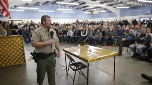 Harney County Sheriff David Ward listens to concerns during a community meeting at the Harney County fairgrounds Wednesday, Jan. 6, 2016, in Burns, Ore.  (AP Photo/Rick Bowmer)