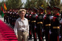 German Defense Minister Ursula von der Leyen inspects the honor guard of the 209th corp of the Afghan army, ANA, at Camp Shaheen outside Mazar-i-Sharif, Afghanistan, Wednesday, July 23, 2014. (AP Photo/Thomas Peter, Pool)
