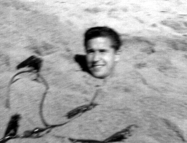 Greg 1962 burried in sand