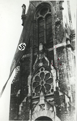  Nazi banner flies in front of a church in Sucha, a town annexed from Poland. 