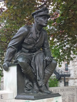 He watches – in a little northern town Through winter cold and parching summer heat