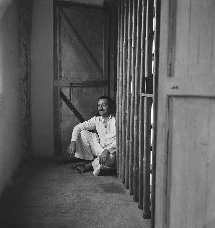AVATAR MEHER BABA outside the Bamboo Cage Room on Meherabad Hill, India, on July 30, 1941. The Cage Room was one of the places Meher Baba spent time in seclusion. (Photo: MSI Collection. Photographer: Padri)